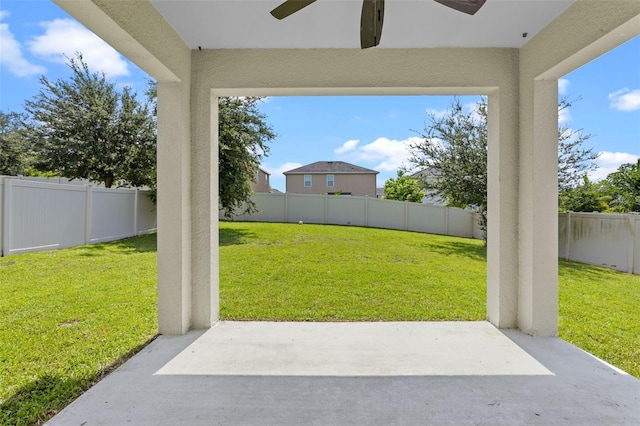 1504 Finchburg St, Minneola, FL 34715 - fenced backyard with a ceiling fan and a patio area