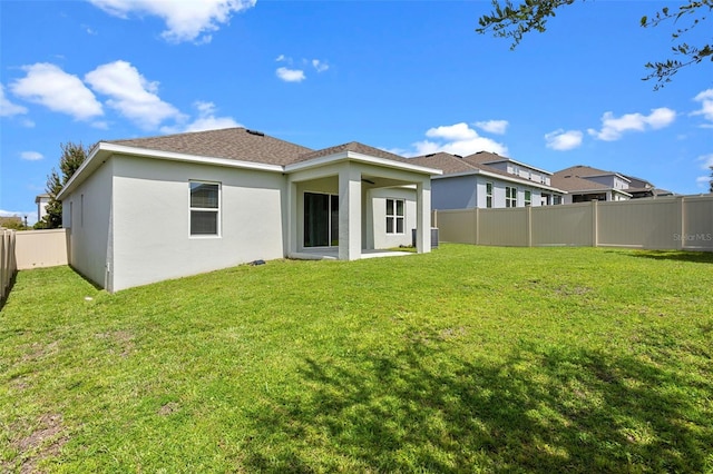 1504 Finchburg St, Minneola, FL 34715 - rear view of house with a fenced backyard and stucco siding