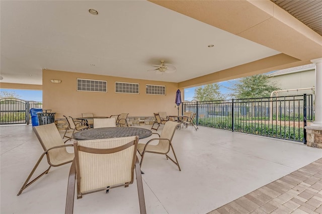 1504 Finchburg St, Minneola, FL 34715 - view of patio with outdoor dining space, a ceiling fan, and a gate