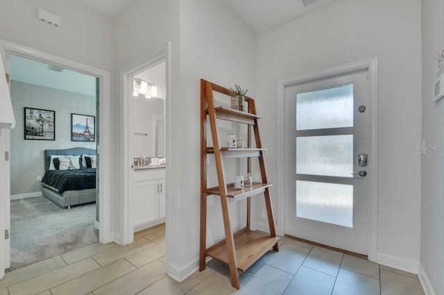 8971 Cabot Cliffs Dr, Davenport, FL 33896 - entrance foyer featuring baseboards and light carpet