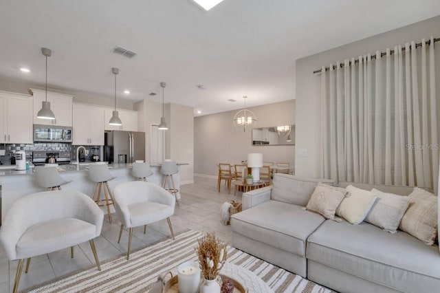 8971 Cabot Cliffs Dr, Davenport, FL 33896 - living area with recessed lighting and a chandelier