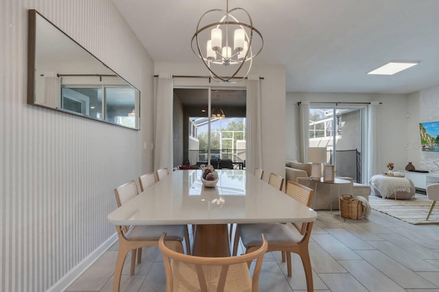 8971 Cabot Cliffs Dr, Davenport, FL 33896 - dining space featuring a chandelier and light tile patterned floors