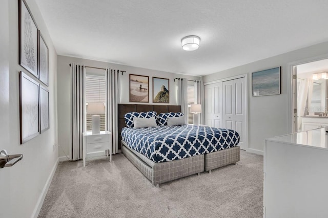 8971 Cabot Cliffs Dr, Davenport, FL 33896 - bedroom featuring light carpet, a closet, and ensuite bath