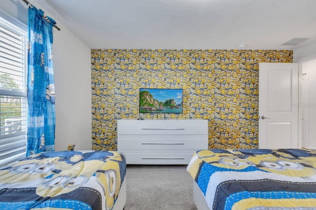 8971 Cabot Cliffs Dr, Davenport, FL 33896 - bedroom featuring carpet flooring and wallpapered walls