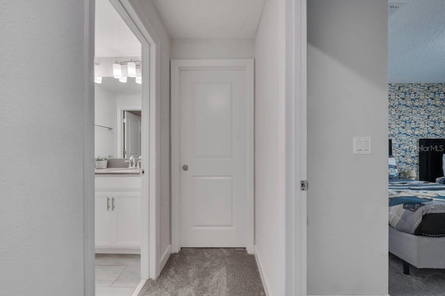 8971 Cabot Cliffs Dr, Davenport, FL 33896 - corridor with light carpet and a sink