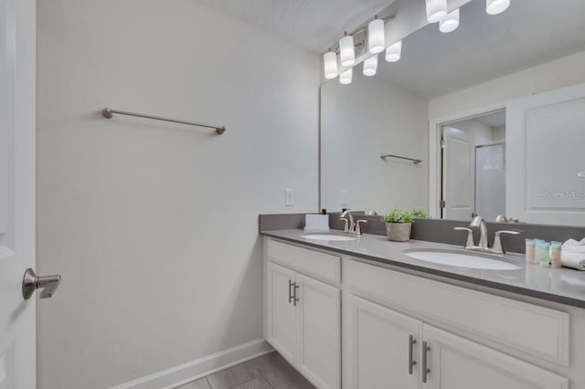 8971 Cabot Cliffs Dr, Davenport, FL 33896 - bathroom with double vanity, a shower with door, and tile patterned floors