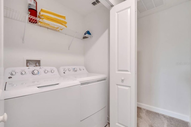 8971 Cabot Cliffs Dr, Davenport, FL 33896 - laundry room with light carpet and separate washer and dryer