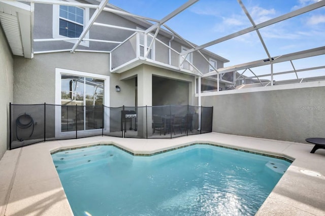 8971 Cabot Cliffs Dr, Davenport, FL 33896 - view of swimming pool with a patio area and glass enclosure