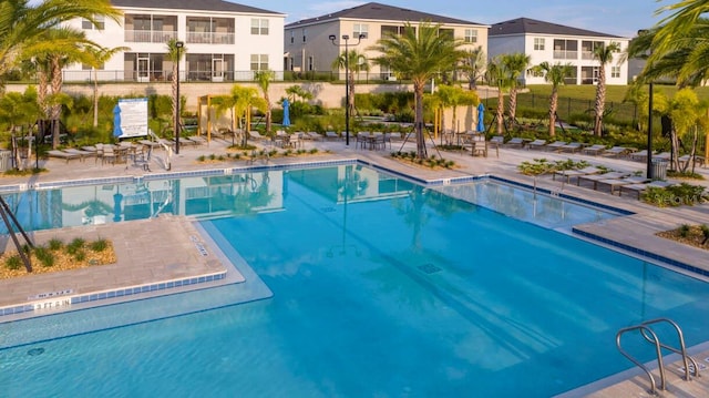 8971 Cabot Cliffs Dr, Davenport, FL 33896 - community pool with a patio