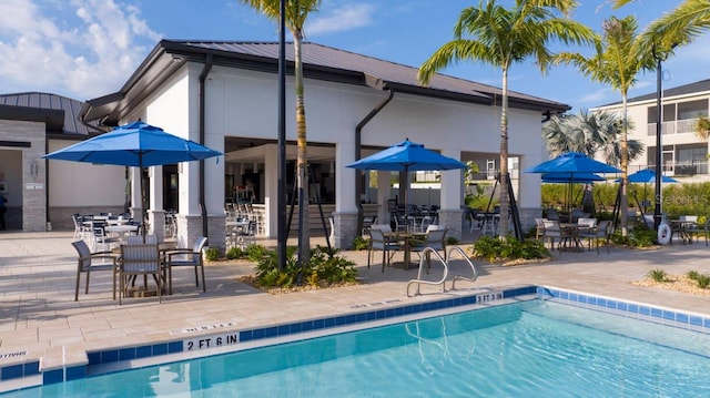 8971 Cabot Cliffs Dr, Davenport, FL 33896 - community pool with a patio area