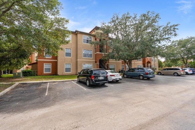 5518 Metrowest Blvd Unit 11-302, Orlando, FL 32811 - view of property with uncovered parking