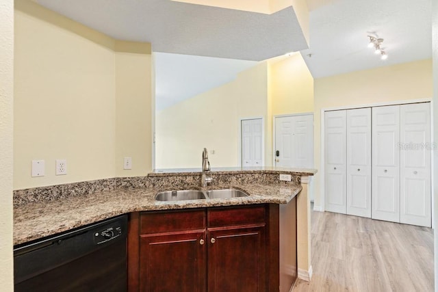 5518 Metrowest Blvd Unit 11-302, Orlando, FL 32811 - kitchen featuring dishwasher, light wood-style floors, light stone countertops, reddish brown cabinets, and a peninsula