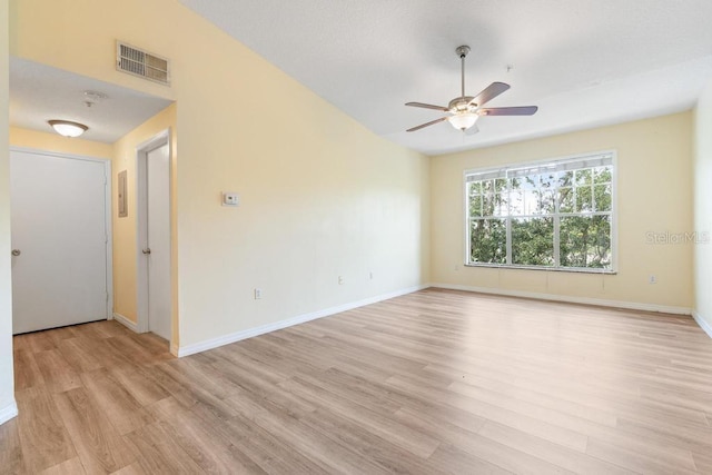 5518 Metrowest Blvd Unit 11-302, Orlando, FL 32811 - empty room with light wood finished floors and ceiling fan