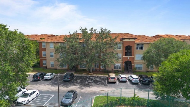5518 Metrowest Blvd Unit 11-302, Orlando, FL 32811 - view of property with uncovered parking