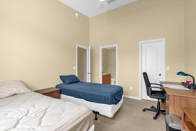 637 Harbor Villa Ct, Clermont, FL 34711 - bedroom featuring light carpet, a towering ceiling, a desk, and connected bathroom