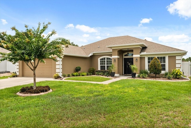 406 Benjamin Ct, Fruitland Park, FL 34731 - view of front of home featuring stucco siding, an attached garage, concrete driveway, and a shingled roof