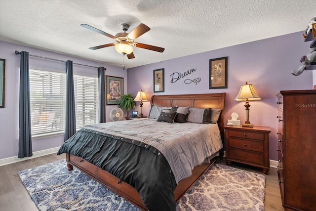 406 Benjamin Ct, Fruitland Park, FL 34731 - bedroom featuring a textured ceiling, wood finished floors, and ceiling fan