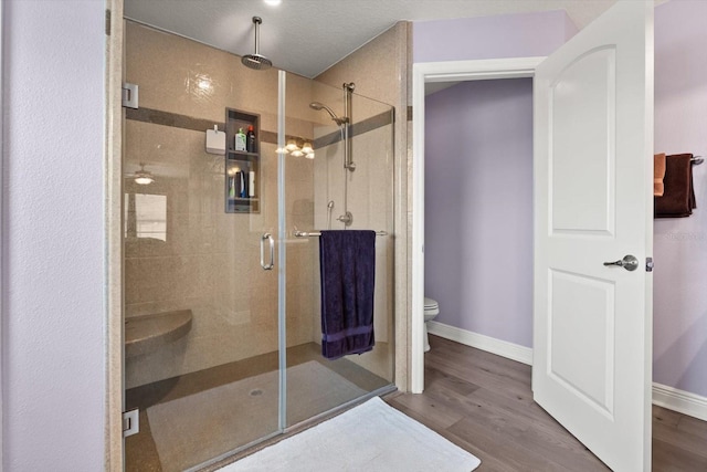 406 Benjamin Ct, Fruitland Park, FL 34731 - bathroom featuring a stall shower and wood finished floors