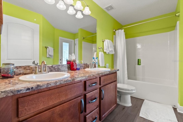 406 Benjamin Ct, Fruitland Park, FL 34731 - bathroom with shower / tub combo, double vanity, wood finished floors, and a chandelier