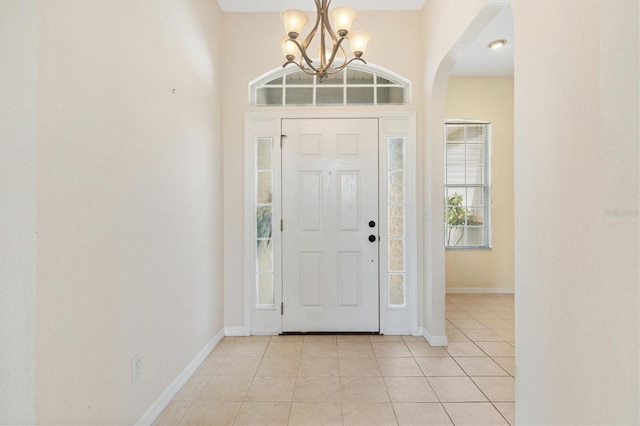 12205 SE 173rd Pl, Summerfield, FL 34491 - foyer entrance featuring arched walkways, a chandelier, and light tile patterned floors