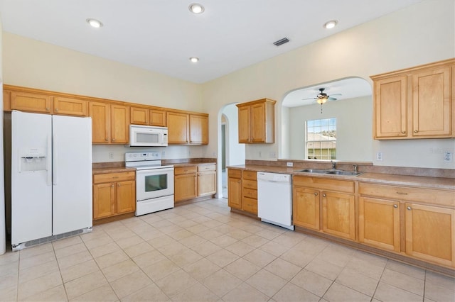 12205 SE 173rd Pl, Summerfield, FL 34491 - kitchen with white appliances, arched walkways, a ceiling fan, and recessed lighting