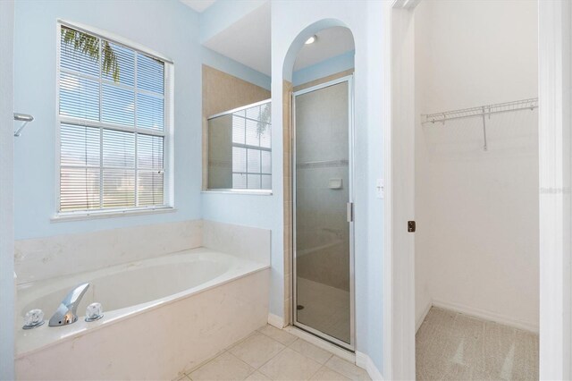12205 SE 173rd Pl, Summerfield, FL 34491 - full bathroom with a garden tub, a stall shower, and plenty of natural light