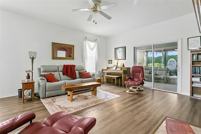 5135 Indian Ocean Loop, Tavares, FL 32778 - living room featuring healthy amount of natural light, wood finished floors, and a ceiling fan