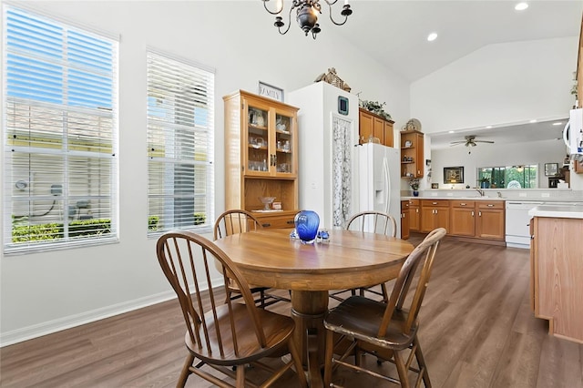 5135 Indian Ocean Loop, Tavares, FL 32778 - dining space featuring dark wood-style floors, a chandelier, ceiling fan, high vaulted ceiling, and recessed lighting