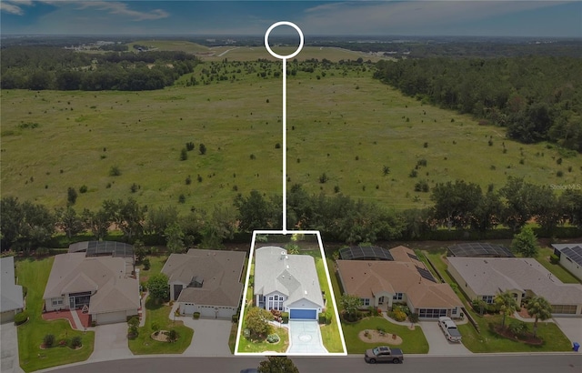 5135 Indian Ocean Loop, Tavares, FL 32778 - aerial perspective of suburban area featuring property boundaries highlighted and a heavily wooded area