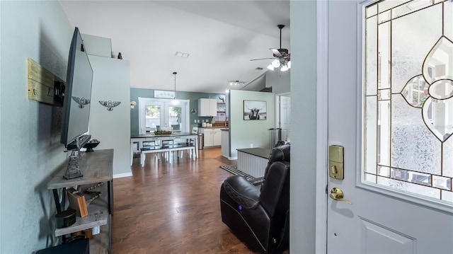 11746 Oswalt Rd, Clermont, FL 34711 - living area featuring vaulted ceiling, a ceiling fan, and dark wood-style flooring