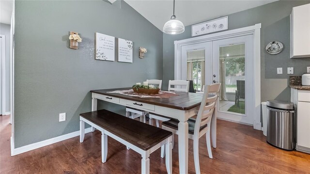 11746 Oswalt Rd, Clermont, FL 34711 - dining area with french doors, wood finished floors, and lofted ceiling