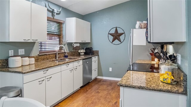 11746 Oswalt Rd, Clermont, FL 34711 - kitchen featuring dishwasher, light wood-style flooring, white cabinets, and stone countertops