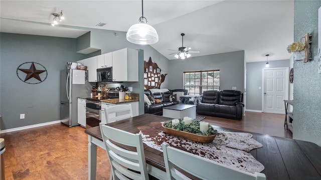 11746 Oswalt Rd, Clermont, FL 34711 - dining space with wood finished floors, vaulted ceiling, and a ceiling fan