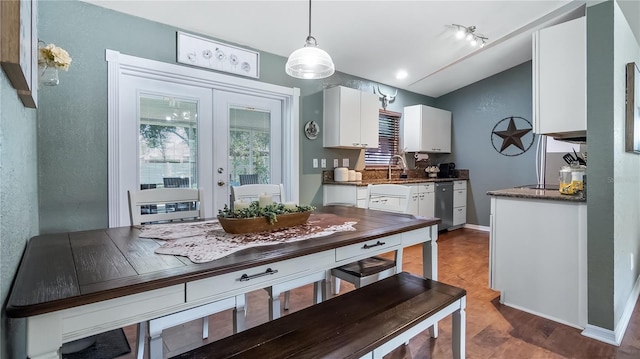 11746 Oswalt Rd, Clermont, FL 34711 - dining room with lofted ceiling, light wood-type flooring, and french doors
