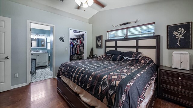 11746 Oswalt Rd, Clermont, FL 34711 - bedroom featuring lofted ceiling, a walk in closet, wood finished floors, connected bathroom, and ceiling fan