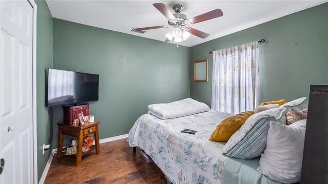 11746 Oswalt Rd, Clermont, FL 34711 - bedroom with wood finished floors and a ceiling fan