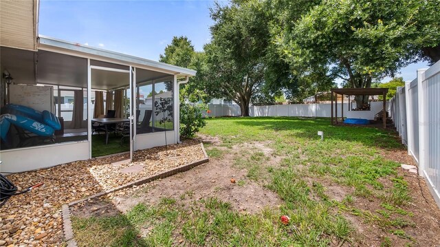 11746 Oswalt Rd, Clermont, FL 34711 - fenced backyard featuring a sunroom