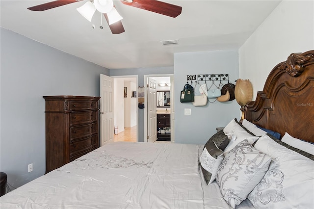 1244 Grandview Cir, Royal Palm Beach, FL 33411 - bedroom with connected bathroom and ceiling fan