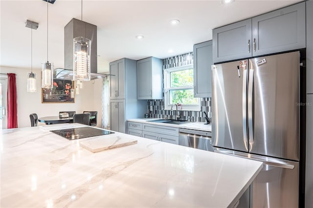 1244 Grandview Cir, Royal Palm Beach, FL 33411 - kitchen featuring appliances with stainless steel finishes, pendant lighting, light stone countertops, tasteful backsplash, and recessed lighting