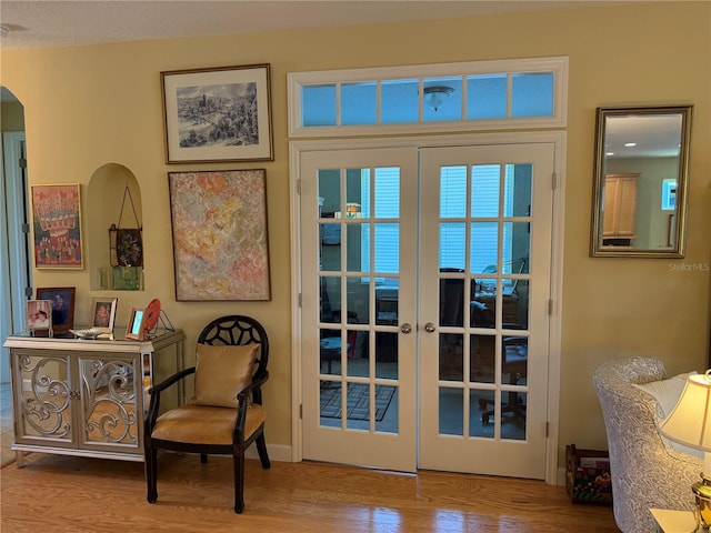 8301 Bridgeport Bay Cir, Mount Dora, FL 32757 - doorway featuring wood finished floors, arched walkways, and french doors