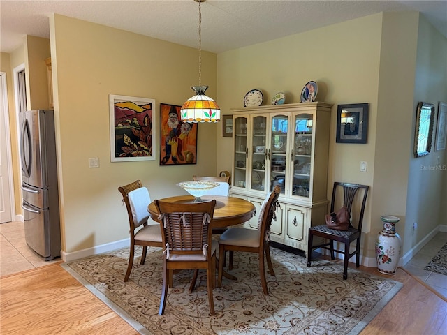 8301 Bridgeport Bay Cir, Mount Dora, FL 32757 - dining space with light wood-style floors