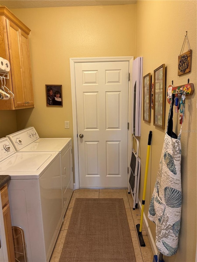 8301 Bridgeport Bay Cir, Mount Dora, FL 32757 - washroom featuring cabinet space, washing machine and clothes dryer, and light tile patterned flooring
