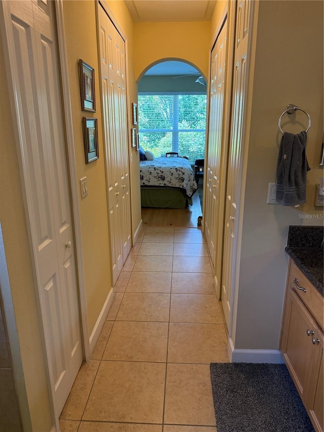 8301 Bridgeport Bay Cir, Mount Dora, FL 32757 - hallway featuring light tile patterned floors