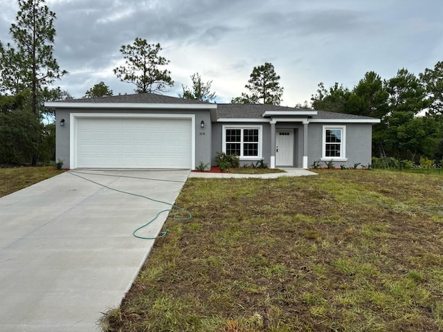3838 W Baton Ln, Citrus Springs, FL 34433 - ranch-style house featuring driveway, stucco siding, a garage, and a front yard