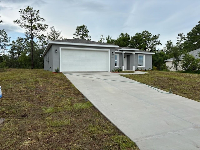 3838 W Baton Ln, Citrus Springs, FL 34433 - view of front of property featuring an attached garage, driveway, stucco siding, and a front lawn