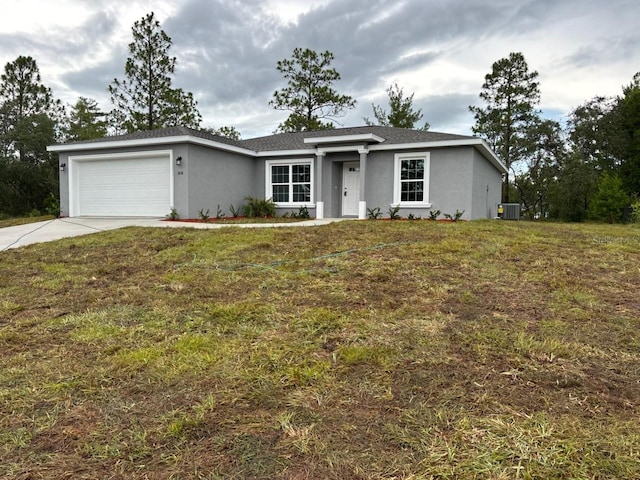 3838 W Baton Ln, Citrus Springs, FL 34433 - ranch-style home with stucco siding, driveway, an attached garage, and a front yard