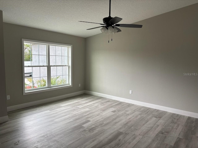 3838 W Baton Ln, Citrus Springs, FL 34433 - empty room featuring wood finished floors, a textured ceiling, and ceiling fan