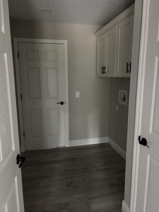 3838 W Baton Ln, Citrus Springs, FL 34433 - washroom featuring dark wood finished floors, washer hookup, and a textured ceiling