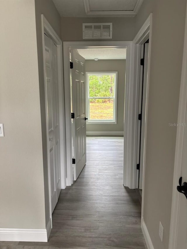 3838 W Baton Ln, Citrus Springs, FL 34433 - hall featuring wood finished floors and attic access