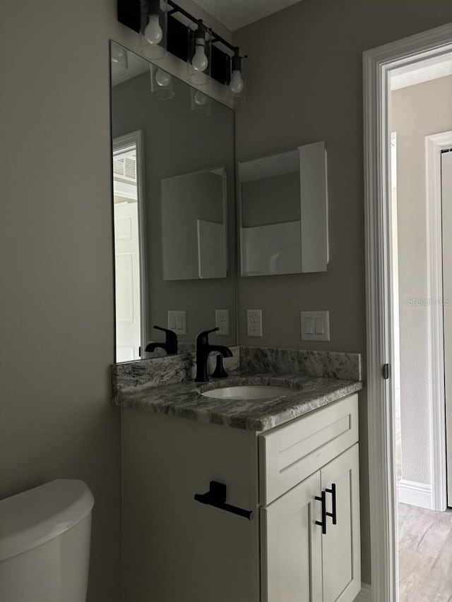 3838 W Baton Ln, Citrus Springs, FL 34433 - half bathroom featuring vanity and toilet